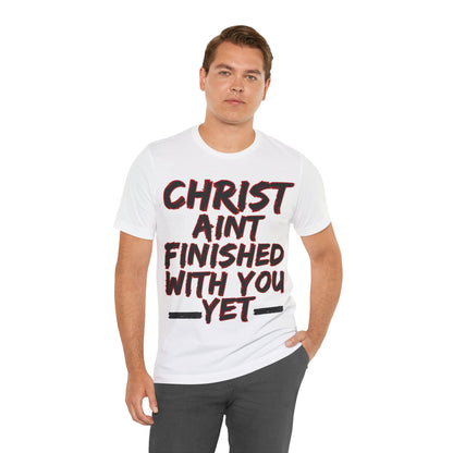 The Holy Fight “Christ Ain’t Finished with You Yet” Motivational Christian T-Shirt – Encouragement in Faith